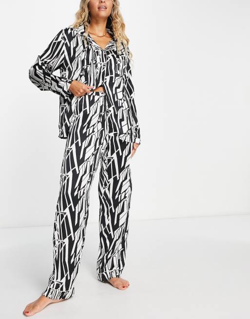Loungeable long button through pyjama set in cream and black abstract print