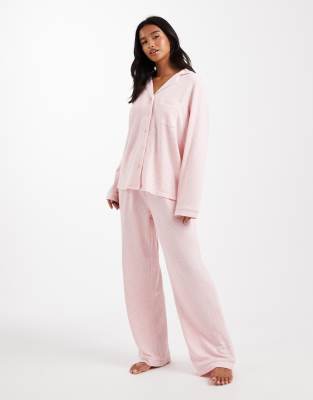 Loungeable Loungeable Petite ribbed revere top and wide leg pyjama set with piping detail in pink melange