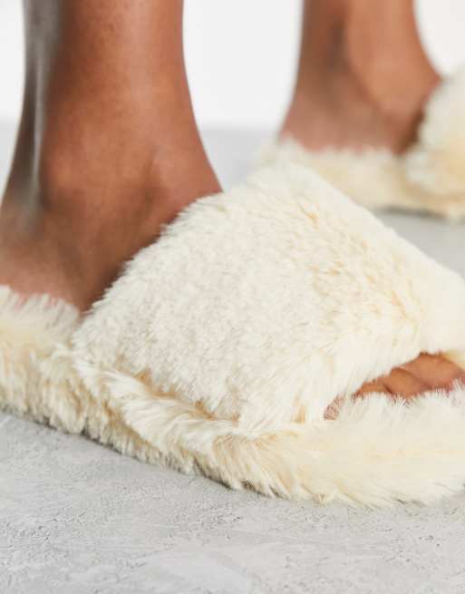 Loungeable faux fur lined PU mule slipper in black and cream