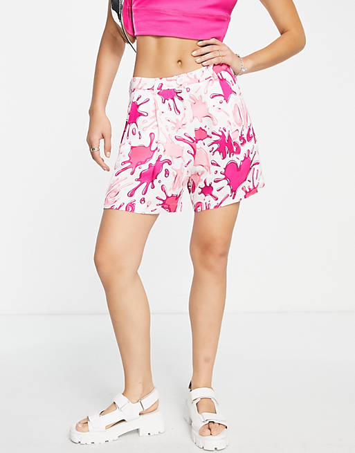 Love Moschino all over splash logo shorts in pink multi