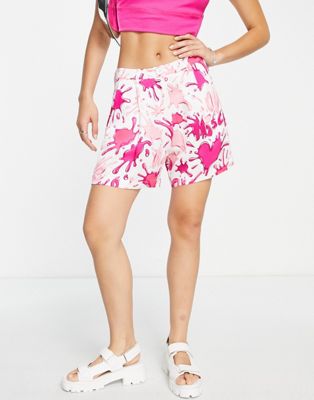 Love Moschino allover splash logo shorts in pink multi