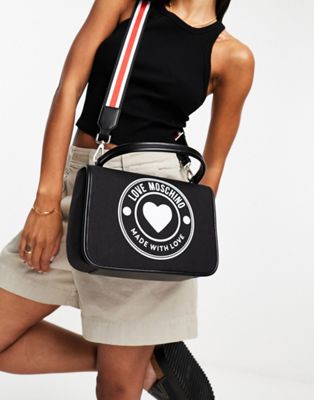 Love Moschino circle logo top handle canvas cross body bag in black