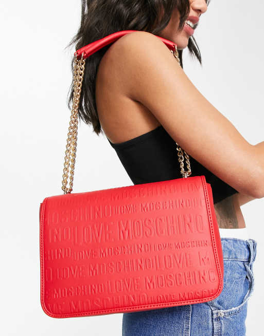 Love Moschino embossed logo flap top shoulder bag in red