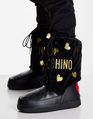 Love Moschino faux fur snow boots with black and gold hearts