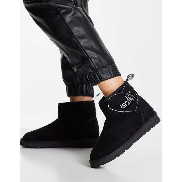 Love Moschino flat heart logo boots in black suede