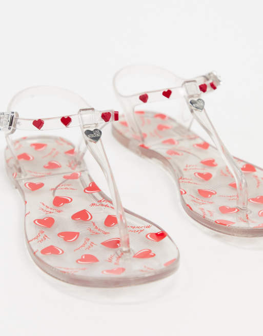 Love Moschino heart jelly flat sandals in clear ASOS