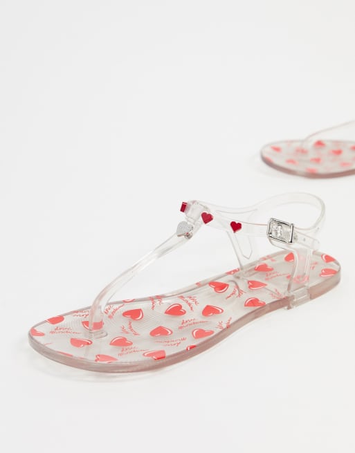 Love Moschino heart jelly flat sandals in clear ASOS