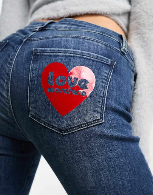 Love Moschino heart print logo skinny jeans in mid blue wash