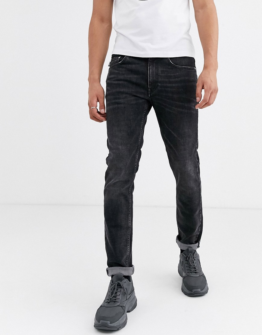 Love Moschino - Jeans slim con applicazione sulla tasca posteriore-Blu
