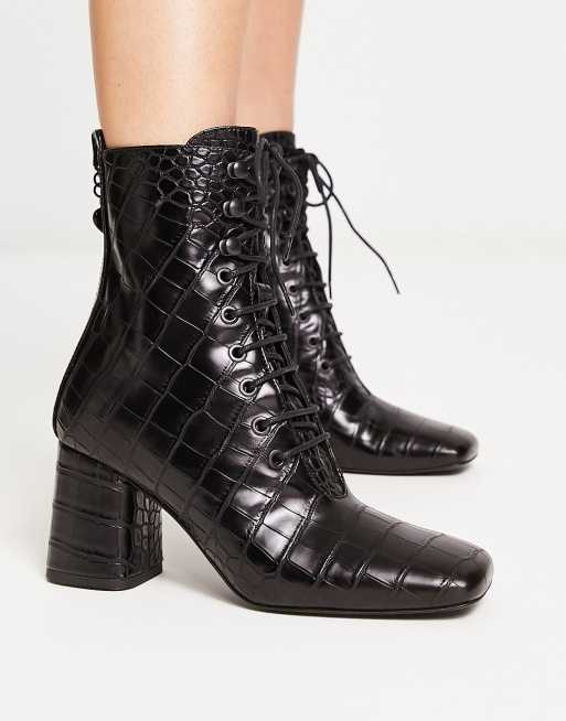 Black boots with sales laces in back