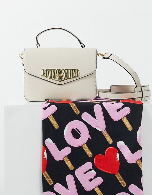 Love Moschino locked in love cross body bag with top handle in cream