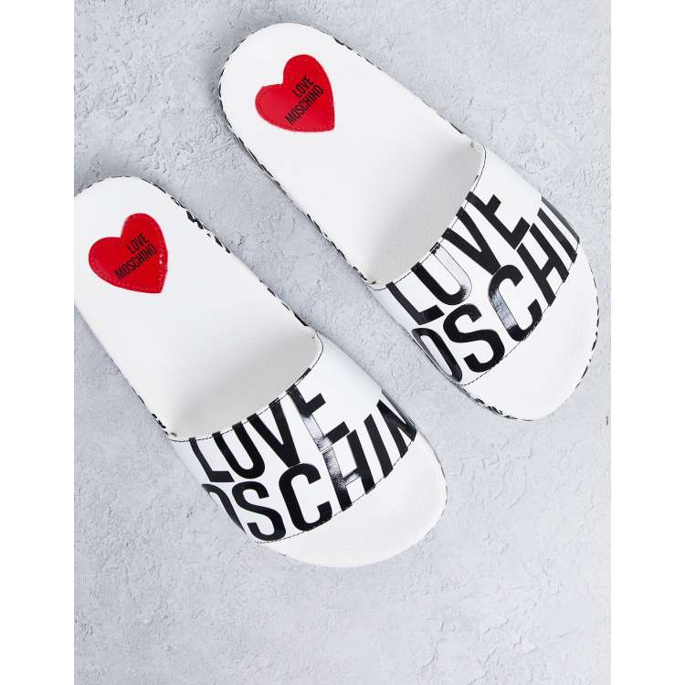 Moschino store white slides