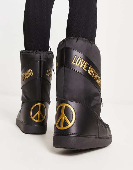Love Moschino logo snowboots in black and gold