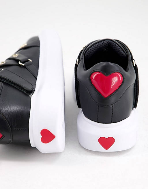  Trainers/Love Moschino multi strap gold heart trainers in black 