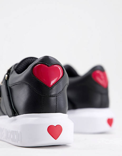  Trainers/Love Moschino multi strap gold heart trainers in black 