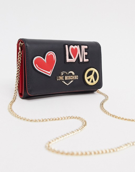 Love Moschino patches purse with chain strap in black