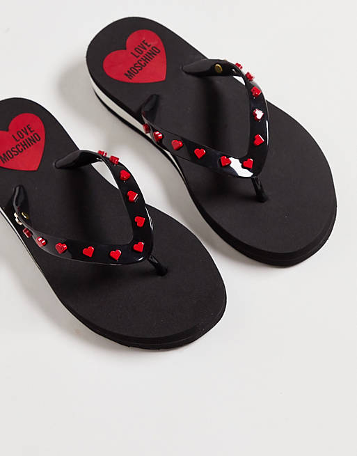 Shoes Flip Flops/Love Moschino studded flip flops in black 