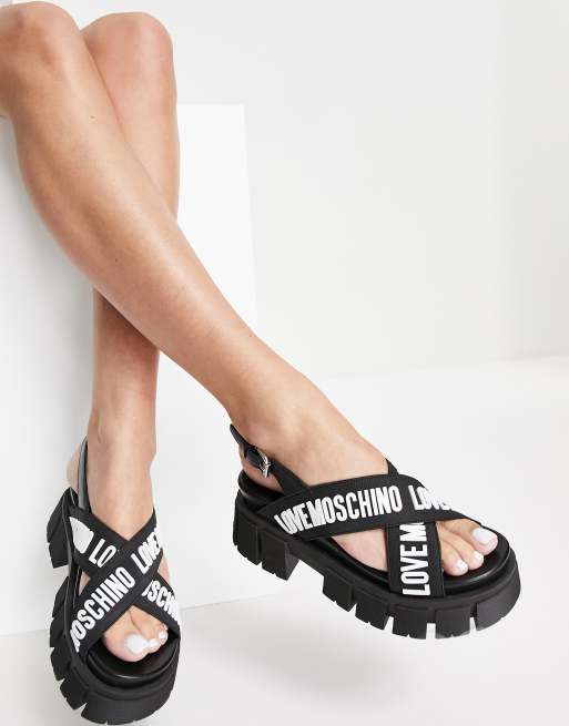 Love Moschino – Svarta, grova sandaler med korsade band med logga