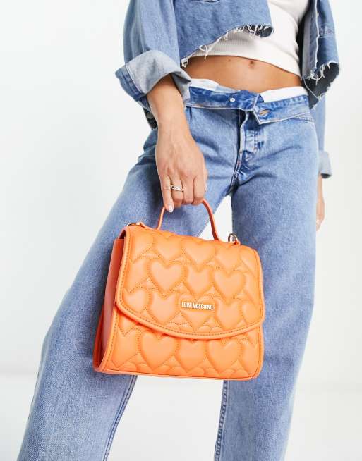 Love Moschino top handle heart quilted crossbody bag in orange ASOS