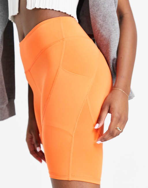 Love & Other Things Plus gym legging shorts in orange