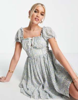 Love Triangle baby dolly mini dress with open back in blue ditsy