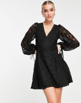 long sleeve mini dress with open back in black lace