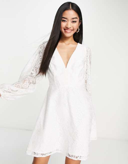 Love Triangle long sleeve mini dress with open back in white lace