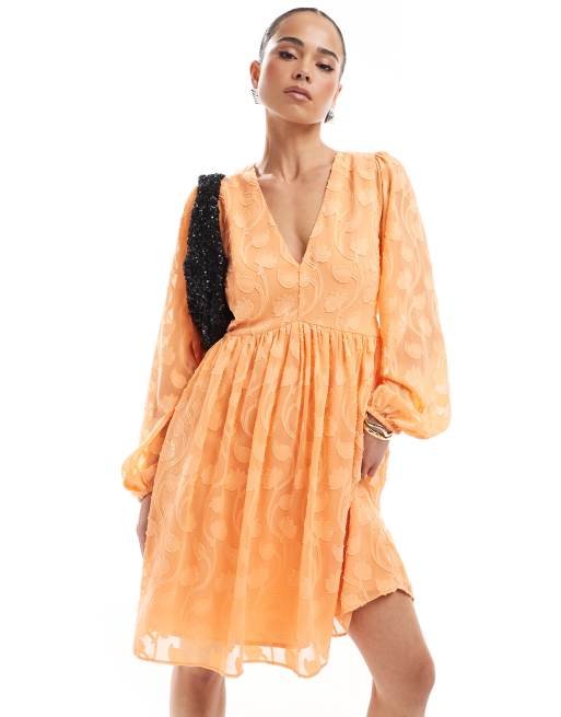 Lovedrobe - Mini-jurk met lange mouwen en burn-out bloemen in oranje