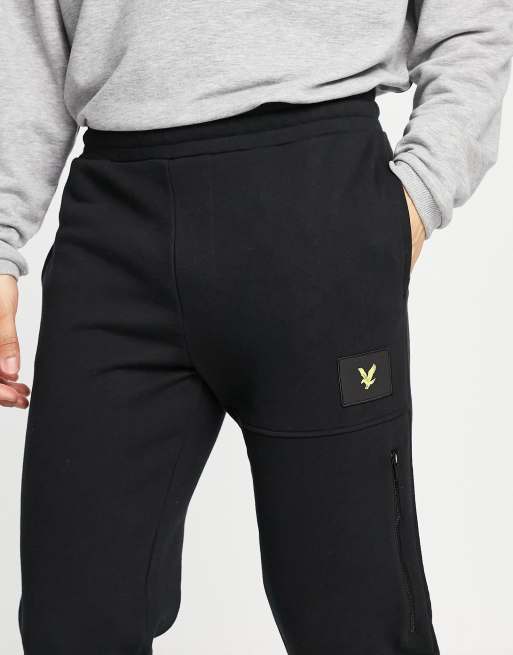 Lyle & Scott badge logo track pants in black