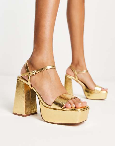 gold and white platform heels