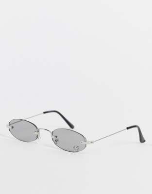 MADEIN. Y2K SLIM OVAL SUNGLASSES WITH DIAMANTE HEART DETAIL IN GRAY-SILVER 