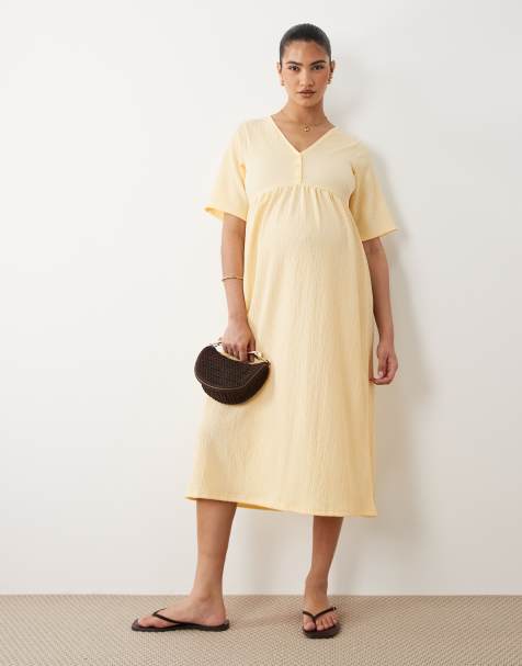 Mamalicious Maternity – Kurzärmliges Still-Midikleid aus strukturiertem Jersey in Gelb mit Knopfdetail - view 1