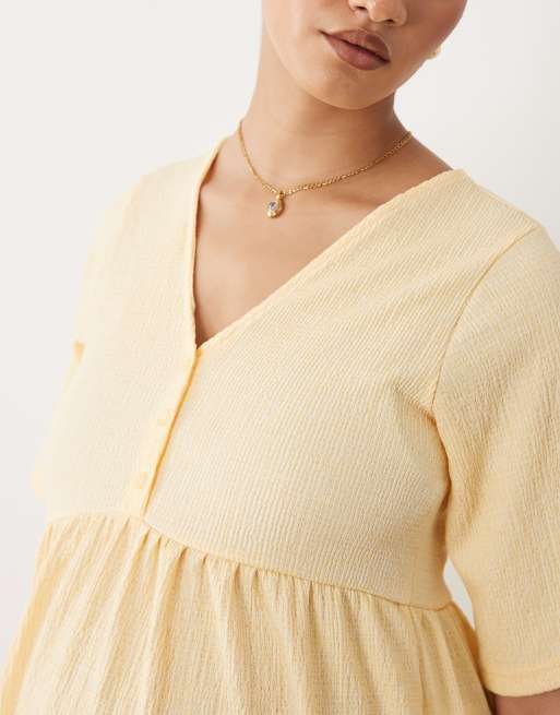 Mamalicious Maternity short sleeve nursing button detail textured jersey  midi dress in yellow | ASOS