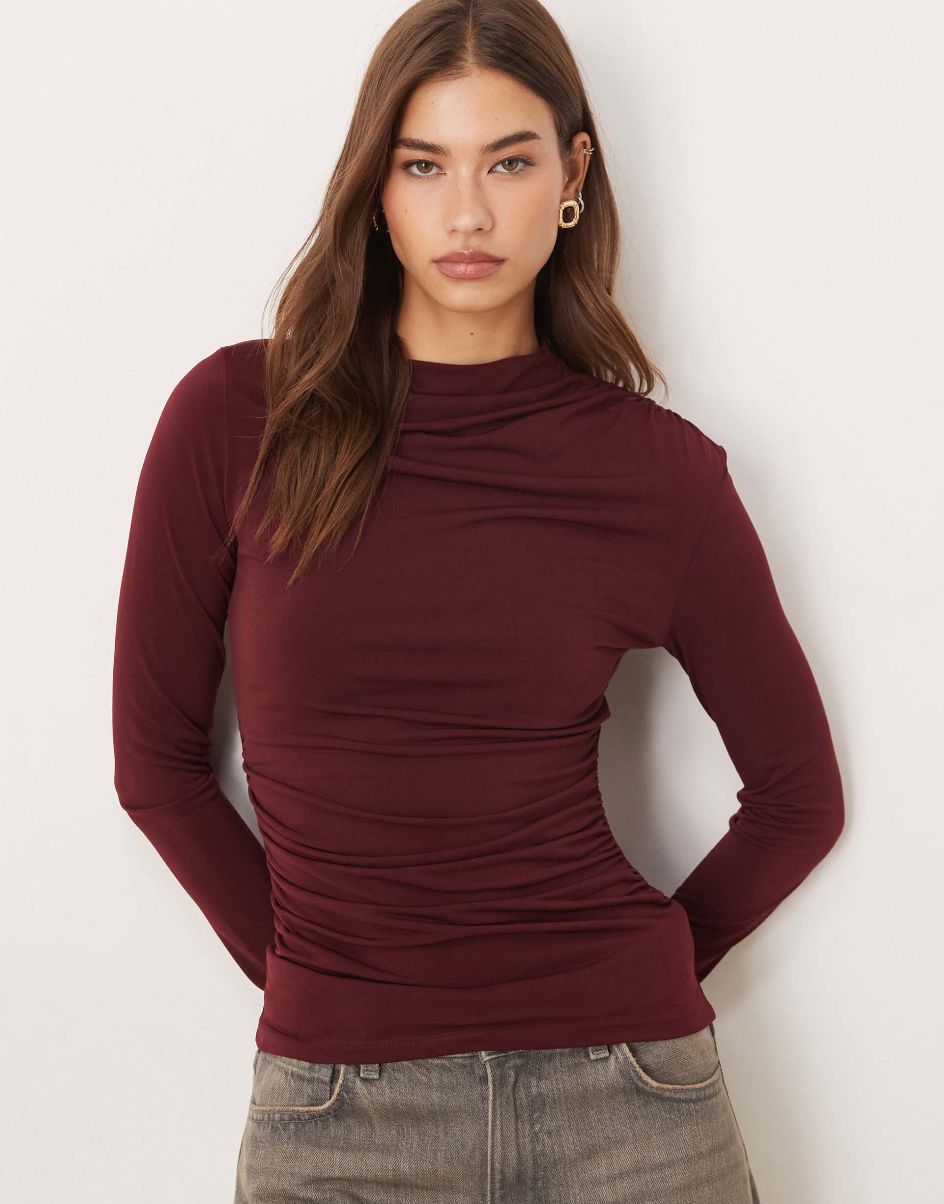 mango asymmetric long sleeve top in burgundy