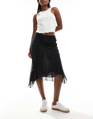 Mango aysmettric hem spot printed midi skirt in black