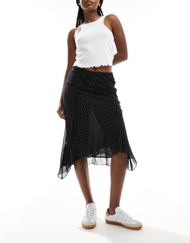 Mango - aysmettric hem spot printed midi skirt in black