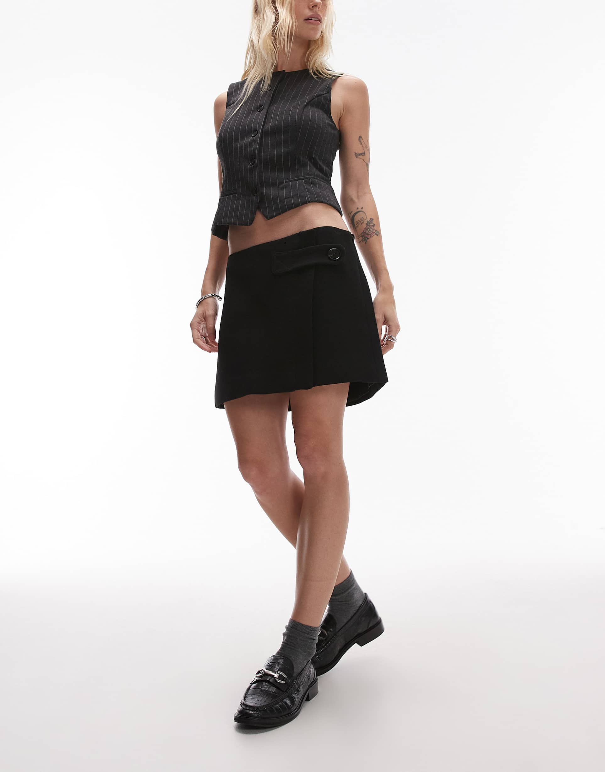 mango button tab mini skirt in black