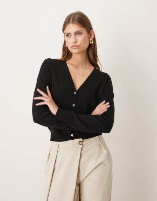 Mango - Capsule - Strukturierte Strickjacke aus 100% Wolle in Schwarz mit V-Ausschnitt