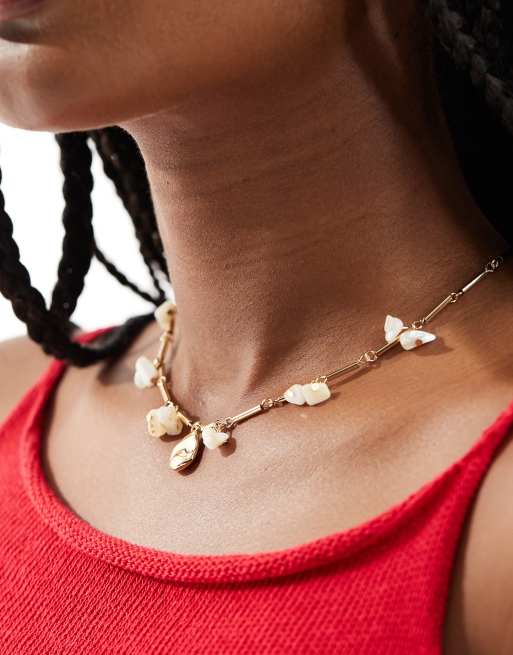 Mango - Collana color oro con ciondolo a perla