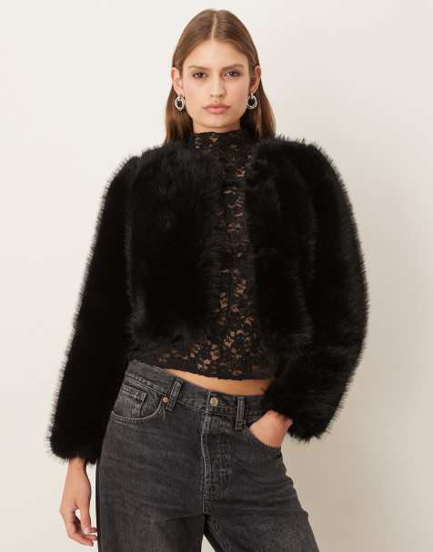 Mango collarless cropped faux fur jacket in black