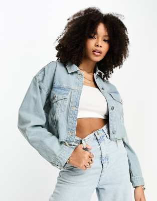 denim jacket with distressed hem in blue