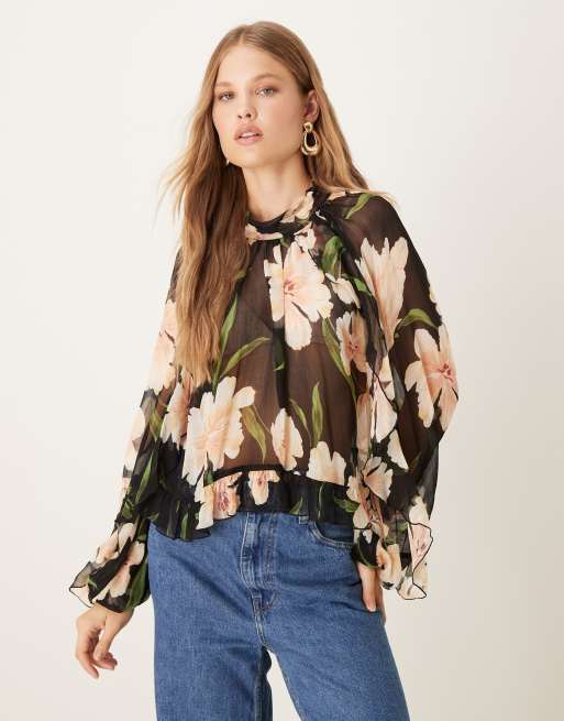 Mango - Doorschijnende blouse met ronde hals en lange mouwen in bloemenprint op donkere ondergrond