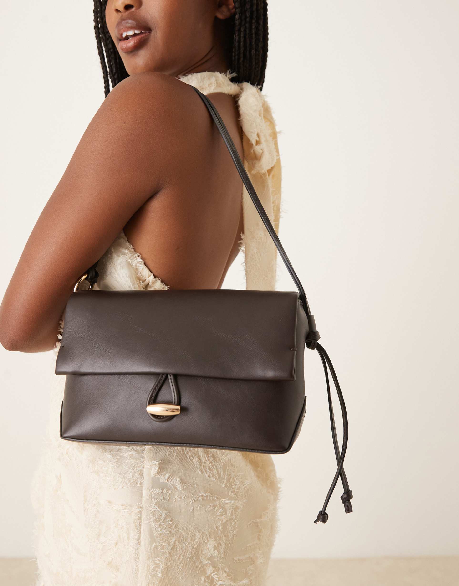 mango elegant hand bag with gold accent closure in black