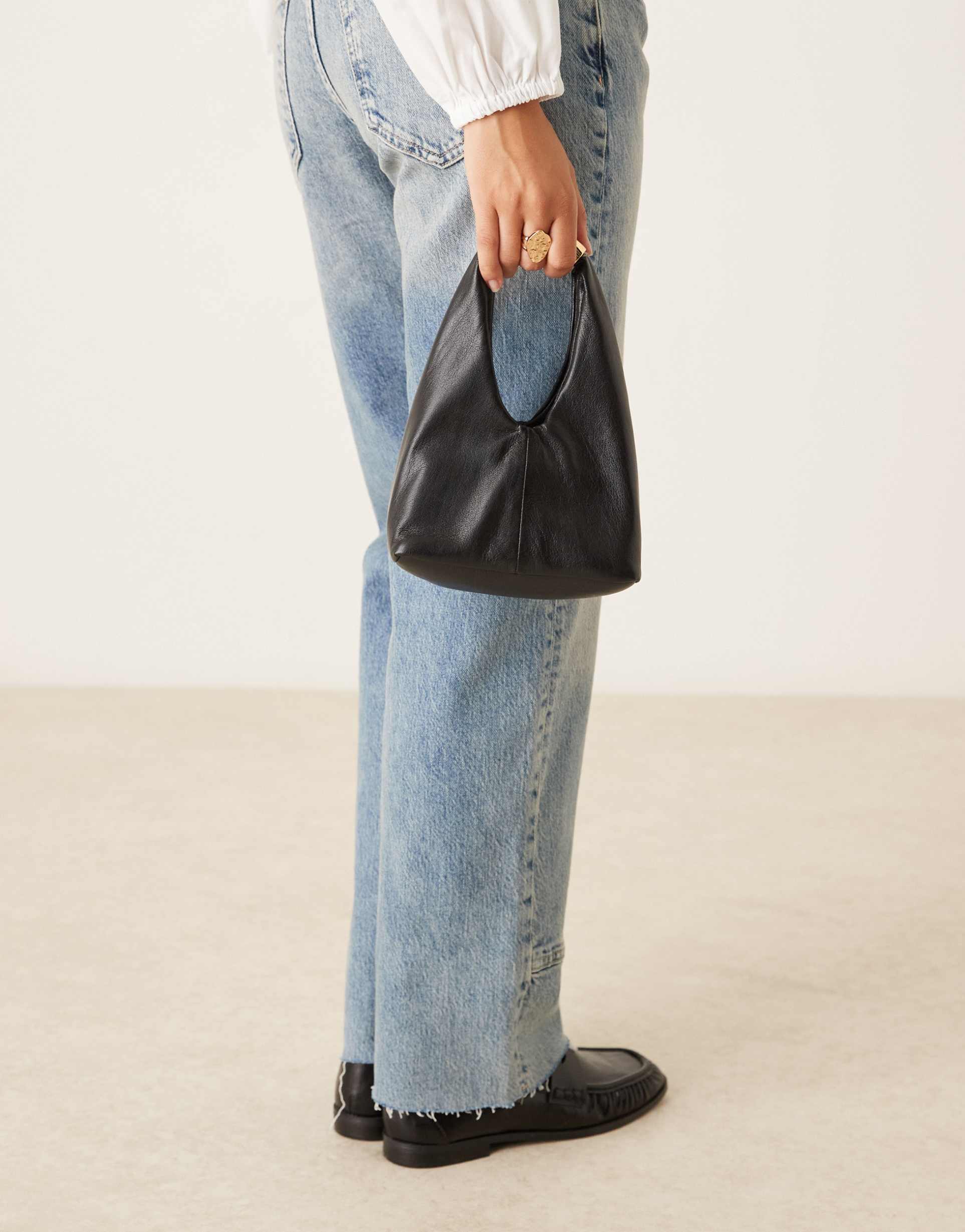 mango faux leather slouchy bag with gold statement handle in black