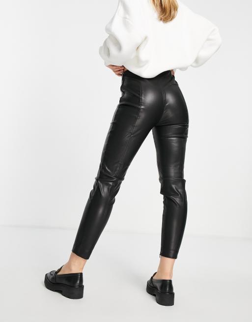 Mango faux leather trousers with side split in black