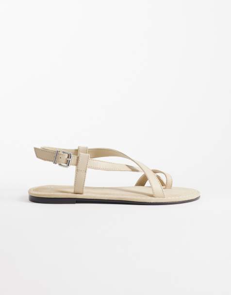 Mango – Flache Sandalen in Sandbeige mit Zehenstegdetail - view 1