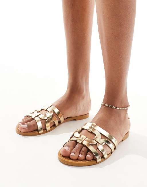 Mango - Flade guldfarvede sandaler i bur-design