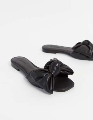 black sandals with a bow