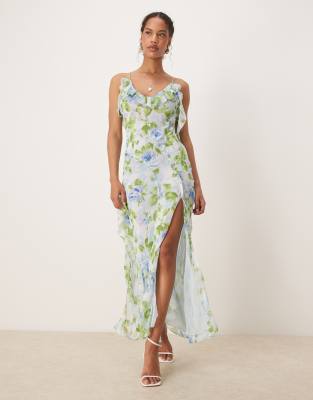 Mango - Kleid in Blassblau mit V-Ausschnitt, Rüschen, Seitenschlitz und botanischem Muster