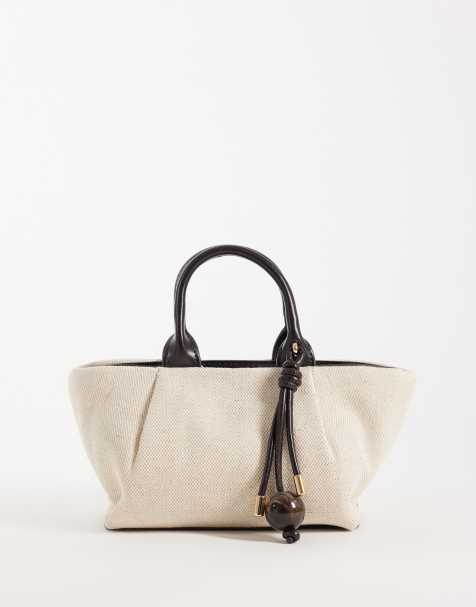 Mango – Kleine, weiche Schultertasche in strukturiertem Schwarz - view 1